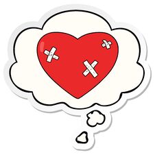 Cartoon Beaten Up Heart And Thought Bubble As A Printed Sticker Stock Photo