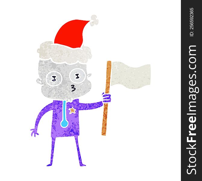 hand drawn retro cartoon of a weird bald spaceman with flag wearing santa hat