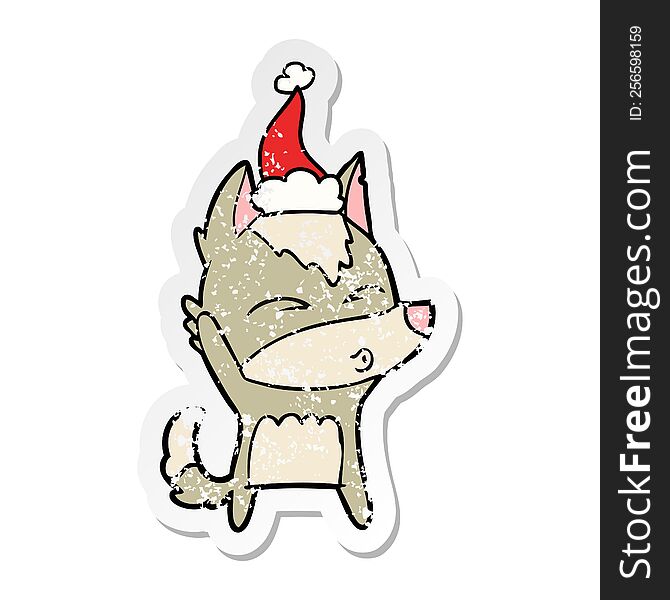 Distressed Sticker Cartoon Of A Wolf Whistling Wearing Santa Hat