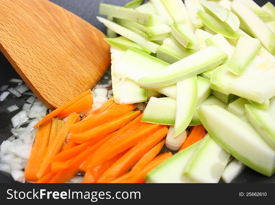 Cut vegetables in frying pan