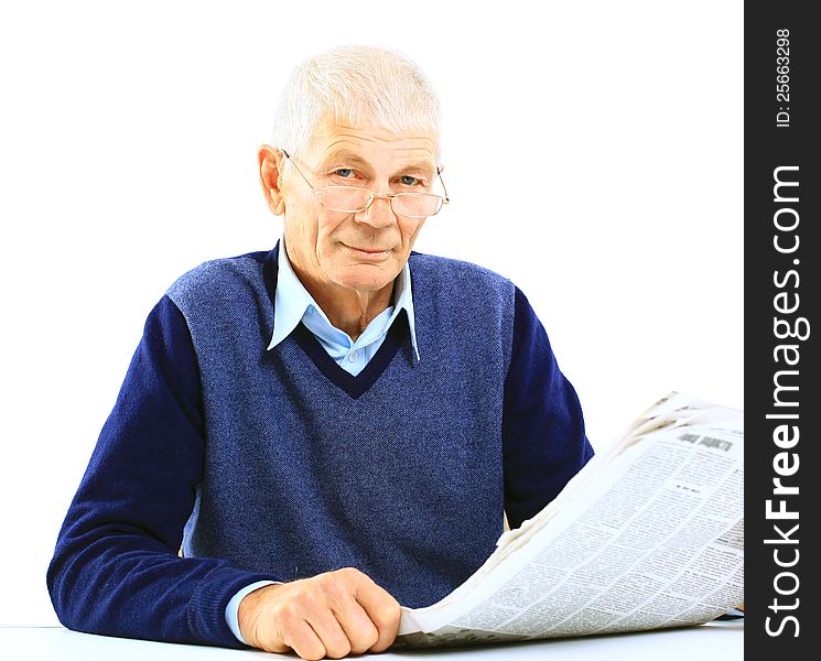 Portrait of an old man solving crosswords in the newspaper. Portrait of an old man solving crosswords in the newspaper