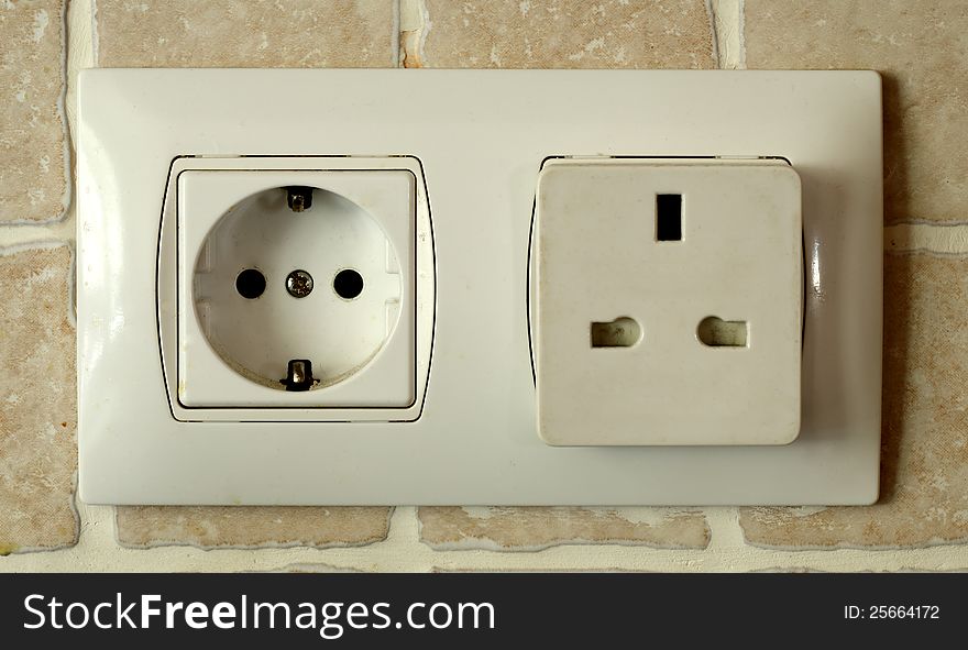 A plug which can accept both continental and United Kingdom Plugs. A plug which can accept both continental and United Kingdom Plugs