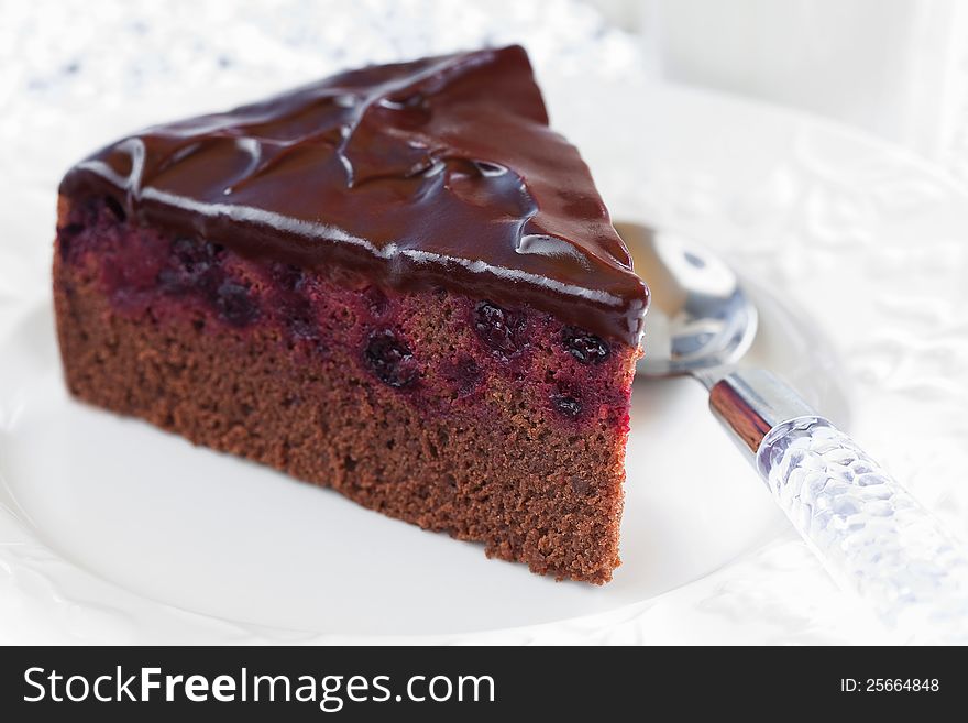 Slice of chocolate blackcurrant cake. Selective focus