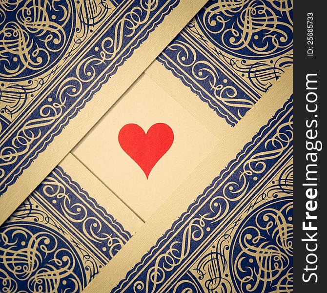 Arrangement of playing cards showing the backside with hearts on the free space