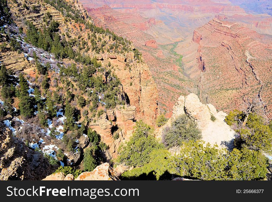 Spectacular vista of the Grand Canyon and the Tree lined Colorado River way down below. Spectacular vista of the Grand Canyon and the Tree lined Colorado River way down below.