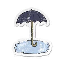 Retro Distressed Sticker Of A Cartoon Wet Umbrella Royalty Free Stock Photo