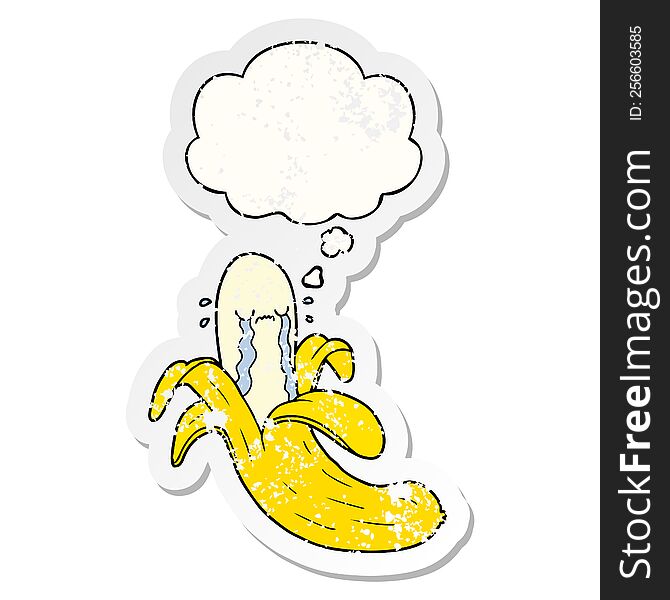 cartoon crying banana with thought bubble as a distressed worn sticker