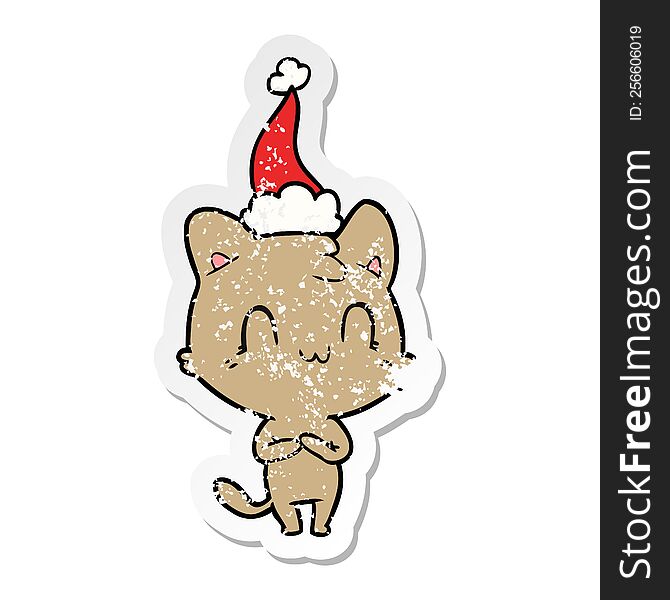 Distressed Sticker Cartoon Of A Happy Cat Wearing Santa Hat