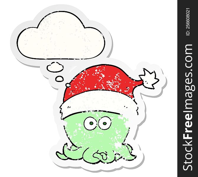 cartoon octopus wearing christmas hat with thought bubble as a distressed worn sticker