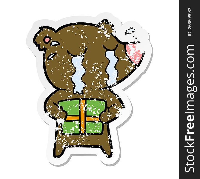 Distressed Sticker Of A Cartoon Crying Bear With Present