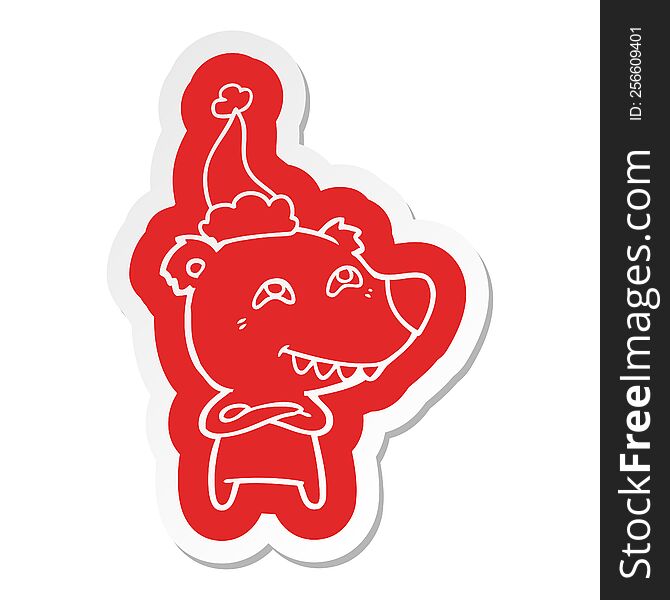 quirky cartoon  sticker of a bear showing teeth wearing santa hat