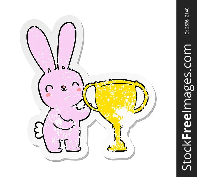 distressed sticker of a cute cartoon rabbit with sports trophy cup