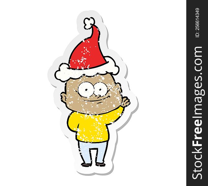 Distressed Sticker Cartoon Of A Bald Man Staring Wearing Santa Hat