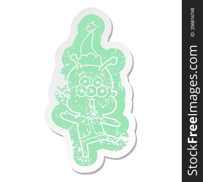 Happy Cartoon Distressed Sticker Of A Alien Dancing Wearing Santa Hat