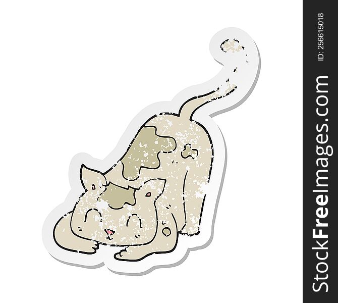 retro distressed sticker of a cartoon cat playing