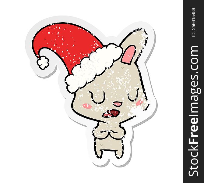 Distressed Sticker Of A Cartoon Rabbit Wearing Christmas Hat