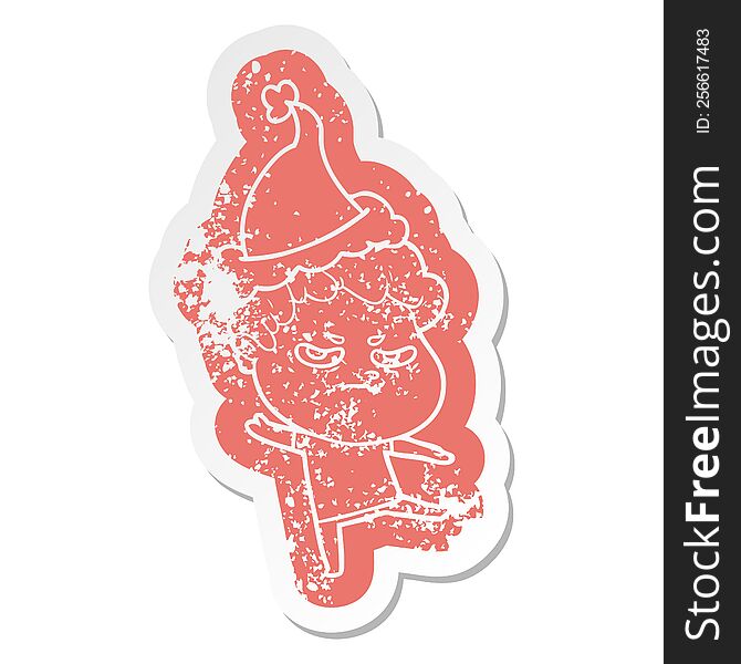Cartoon Distressed Sticker Of A Angry Man Wearing Santa Hat