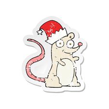 Retro Distressed Sticker Of A Cartoon Mouse Wearing Christmas Hat Stock Photo