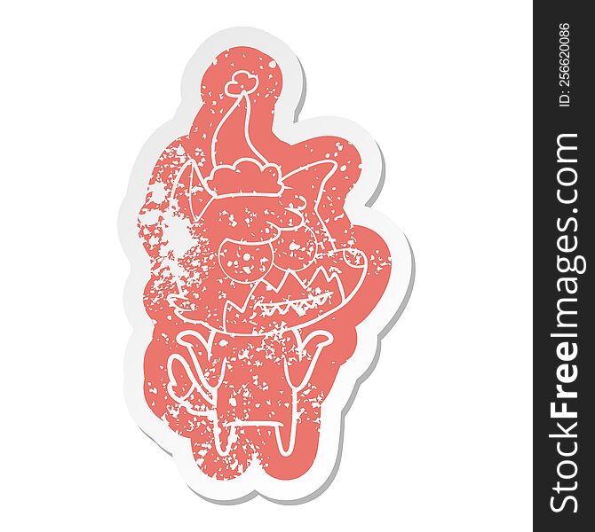 Cartoon Distressed Sticker Of A Grinning Fox Wearing Santa Hat