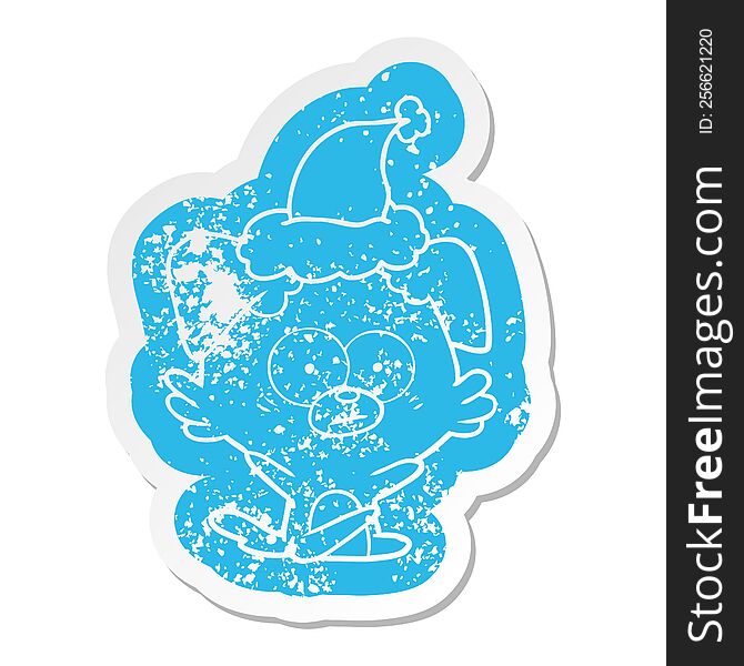 Nervous Dog Cartoon Distressed Sticker Of A Wearing Santa Hat