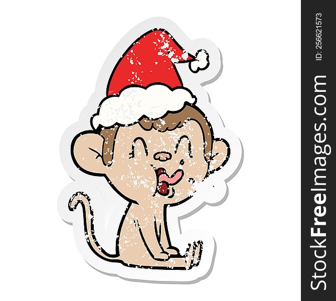 crazy hand drawn distressed sticker cartoon of a monkey sitting wearing santa hat