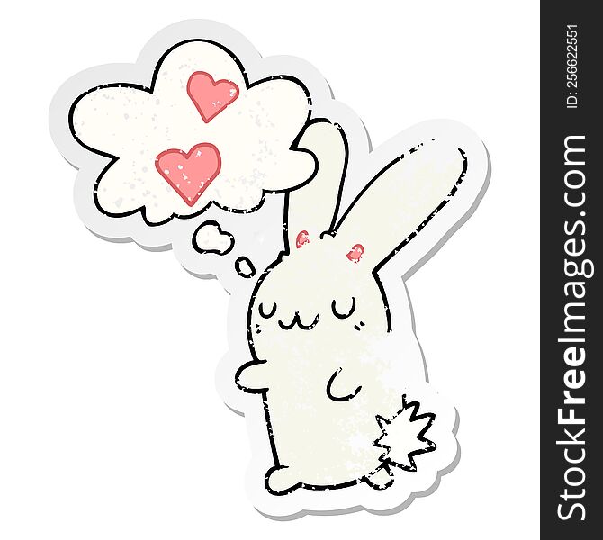 cartoon rabbit in love with thought bubble as a distressed worn sticker
