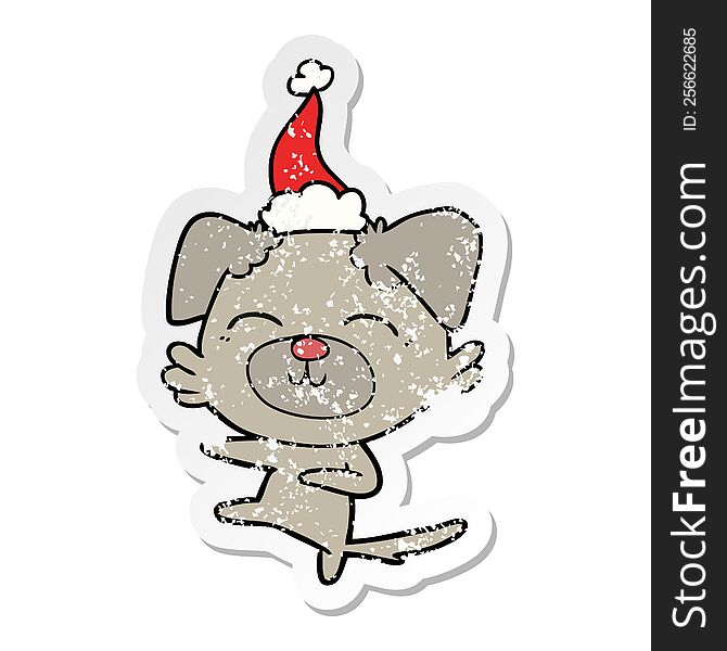 hand drawn distressed sticker cartoon of a dog kicking wearing santa hat