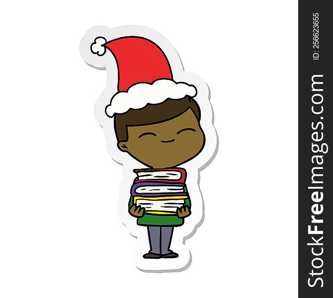 hand drawn sticker cartoon of a smiling boy with stack of books wearing santa hat