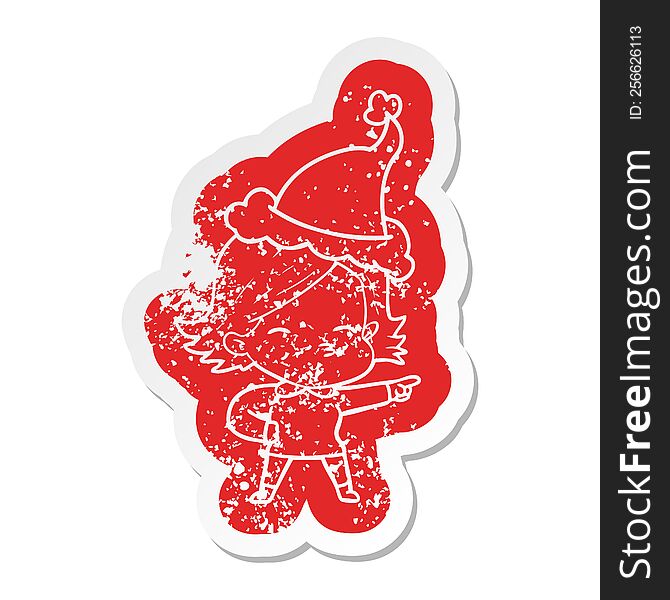 cartoon distressed sticker of a woman pointing wearing santa hat