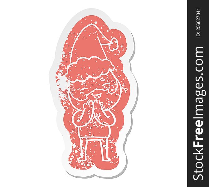 quirky cartoon distressed sticker of a happy bearded man wearing santa hat