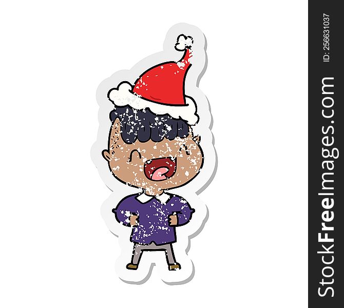 Distressed Sticker Cartoon Of A Happy Boy Laughing Wearing Santa Hat