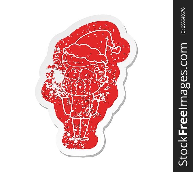 Cartoon Distressed Sticker Of A Crying Man Wearing Santa Hat