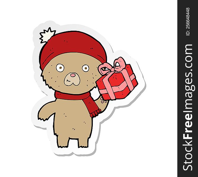 sticker of a cartoon christmas teddy bear with present