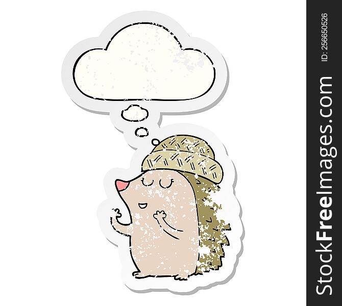 cartoon hedgehog wearing hat with thought bubble as a distressed worn sticker