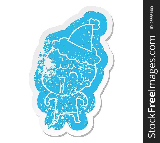 quirky cartoon distressed sticker of a happy man wearing santa hat