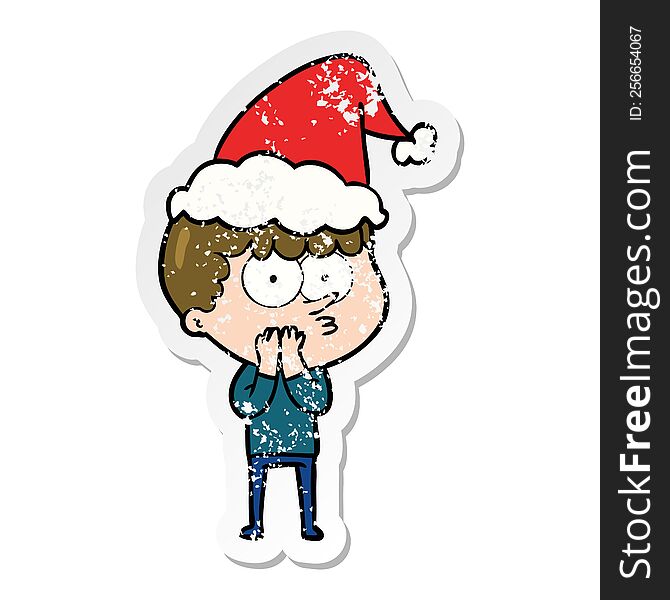 hand drawn distressed sticker cartoon of a curious boy wearing santa hat