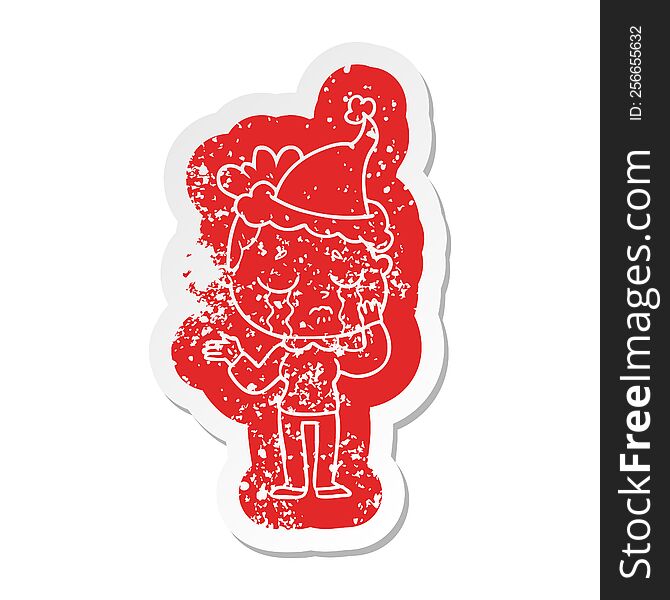 quirky cartoon distressed sticker of a crying woman wearing santa hat