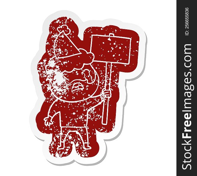 quirky cartoon distressed sticker of a bearded protester crying wearing santa hat