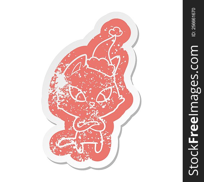 confused quirky cartoon distressed sticker of a cat wearing santa hat