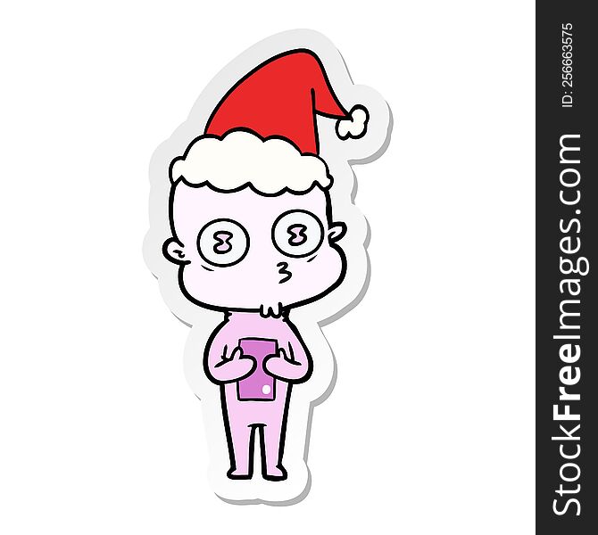 Sticker Cartoon Of A Weird Bald Spaceman Wearing Santa Hat
