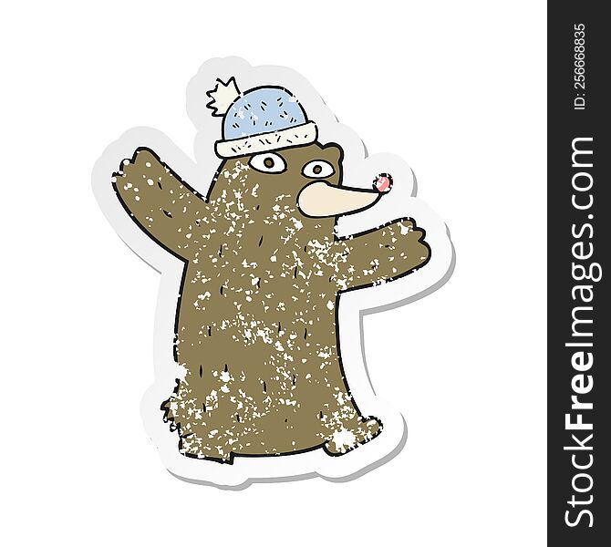 Retro Distressed Sticker Of A Cartoon Bear Wearing Hat