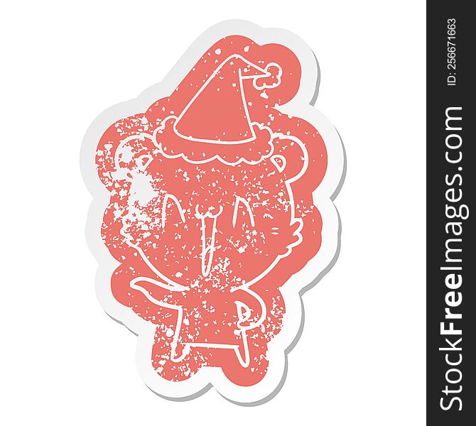 laughing polar bear quirky cartoon distressed sticker of a wearing santa hat