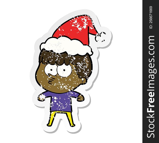 hand drawn distressed sticker cartoon of a curious boy wearing santa hat