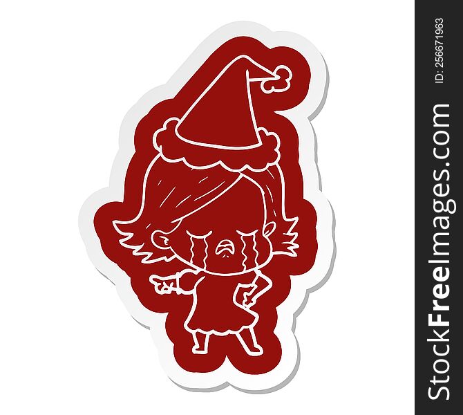 quirky cartoon  sticker of a girl crying and pointing wearing santa hat