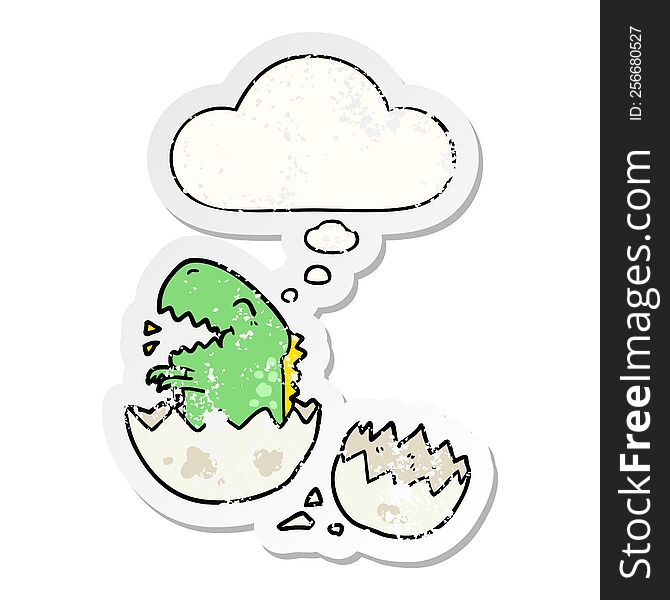 cartoon dinosaur hatching with thought bubble as a distressed worn sticker