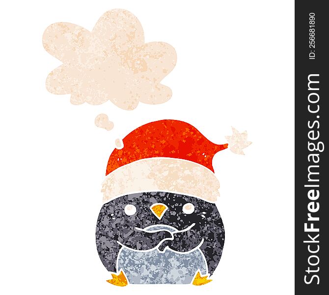 cute cartoon penguin wearing christmas hat and thought bubble in retro textured style