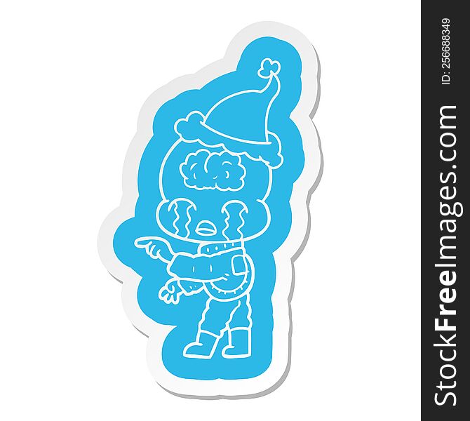 Cartoon  Sticker Of A Big Brain Alien Crying And Pointing Wearing Santa Hat