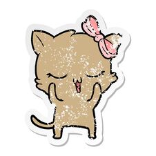 Distressed Sticker Of A Cartoon Cat With Bow On Head Stock Image