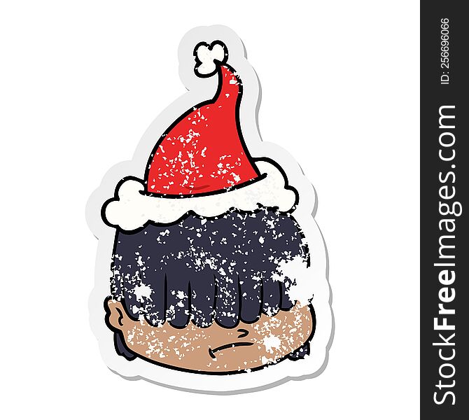 Distressed Sticker Cartoon Of A Face With Hair Over Eyes Wearing Santa Hat