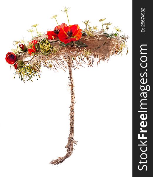 Umbrella of burlap and artificial flowers poppy